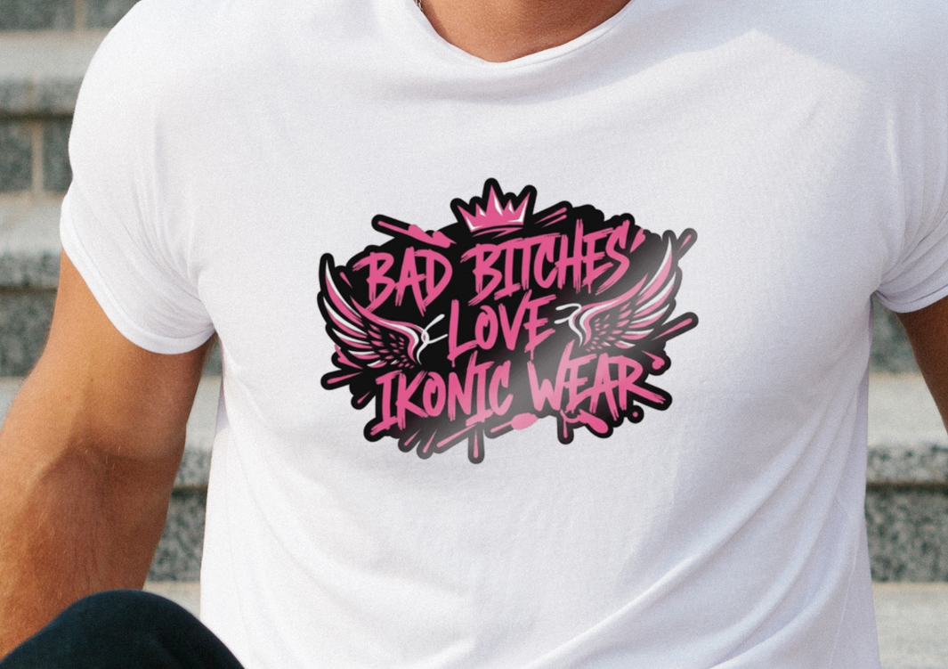 Man wearing a white t-shirt with graphic text sitting on steps
