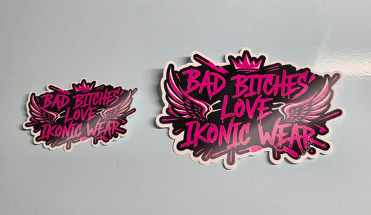 Two 'Bad Bitches Love Ikonic Wear' stickers on a gray background