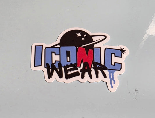 Sticker with 'Iconic Wear' text on a textured surface