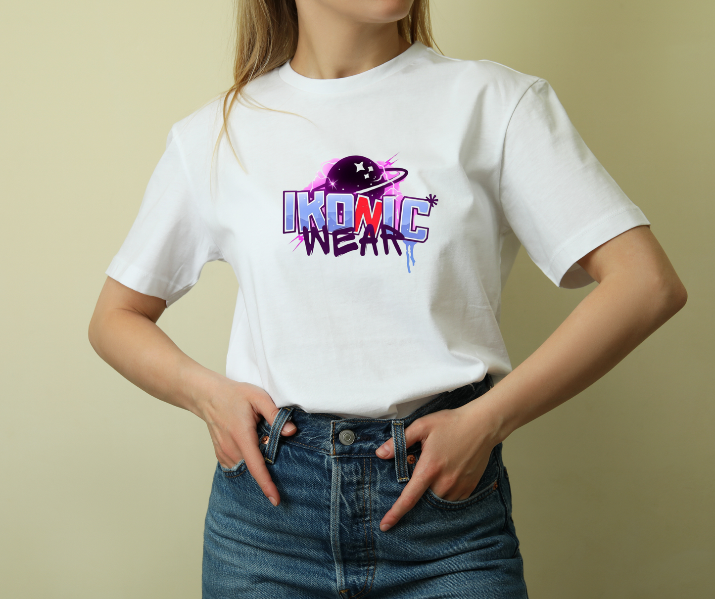 Person wearing a white t-shirt with 'IKONIC WEAR' logo on a beige background