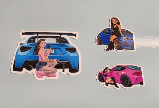 Stickers of a woman with a blue car, a woman with a pink car, and a woman with a black car on a gray background.