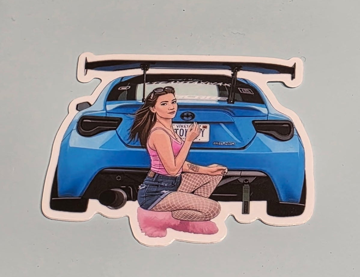 Close-up image of sticker featuring a woman with a blue car on a gray background.